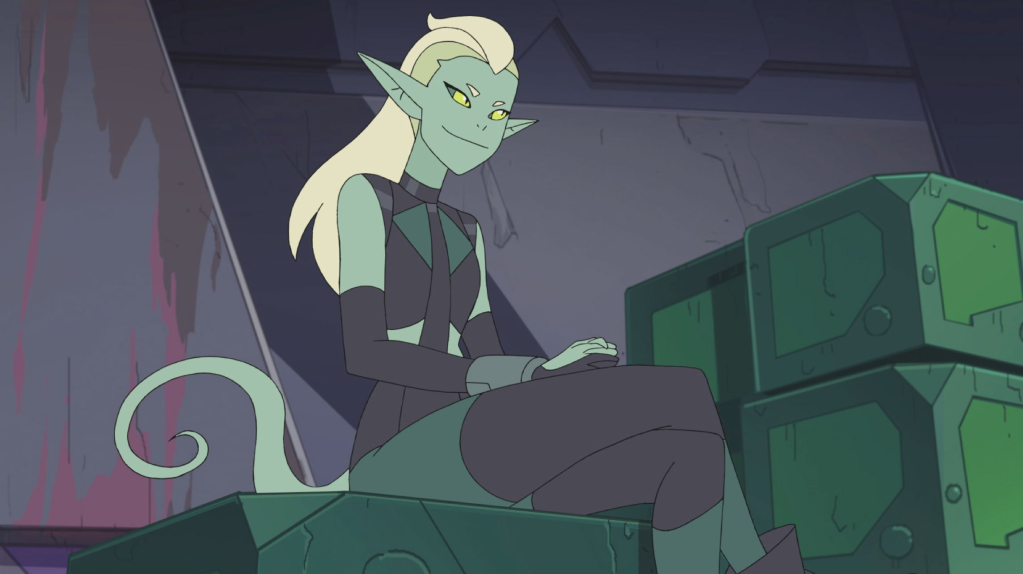 An image of Double Trouble - a green elf-like character - setting on a crate.